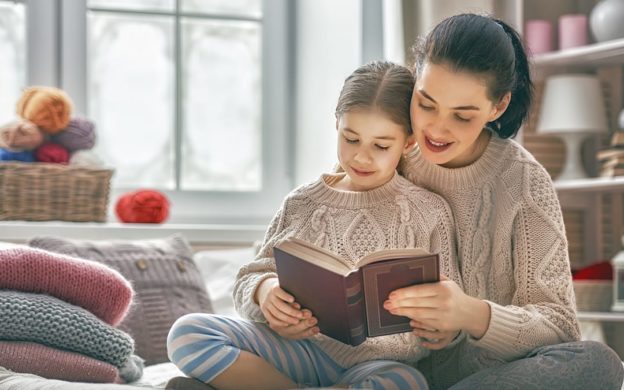 Mother reading book to daughter | Heating and Air Companies - Your Partner for Any Home HVAC Needs | Keith Air Conditioning